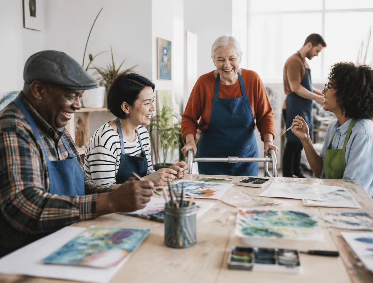 A diverse group of people enjoying a community art class together
